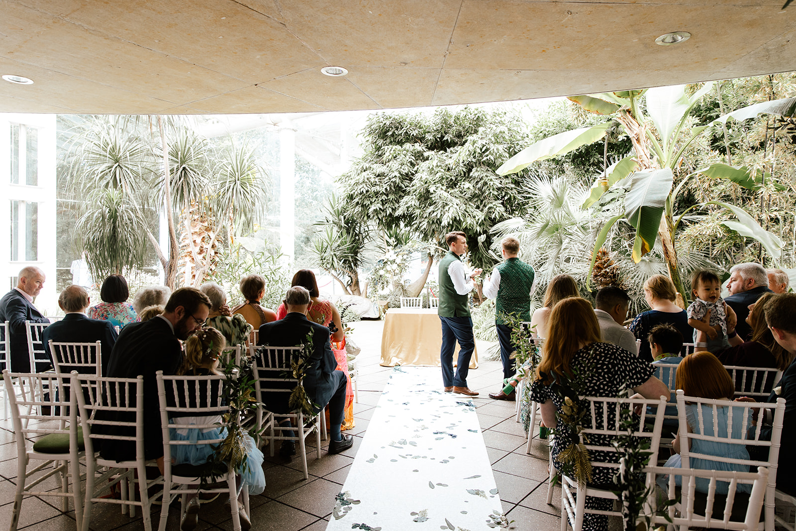 Wedding venue with botanical garden in the background. - Happy couple getting married.
